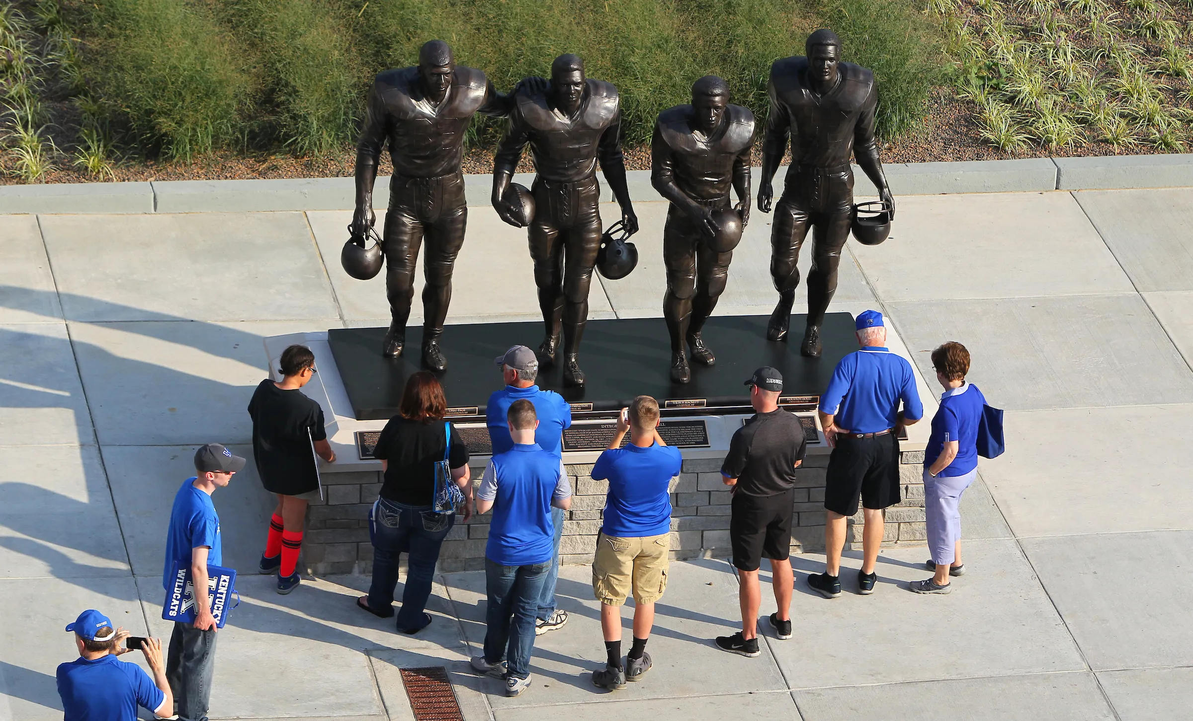 Statue outside UK's stadium of the four football players who broke the SEC color line in the 1960s. (Left to right) Statue features Greg Page, Nate Northington, Wilbur Hackett, and Houston Hogg. Barry Westerman | Louisville Real Estate Photography.