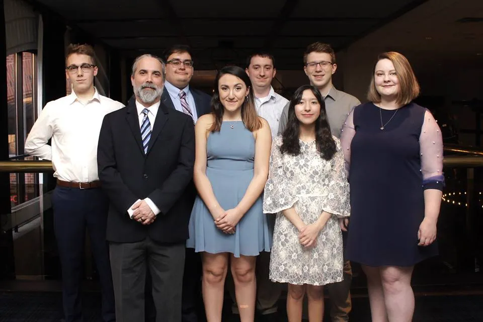 (Front row, left to right): Dave Arnett (coach), Jacinda Rivas, Maria Sanchez and Genevieve Hackman. (Back row, left to right): Dan Bannister, Amar Adam (coach), Lincoln Garrett (coach) and Anthony Trufanov. Photo provided by the NDT.