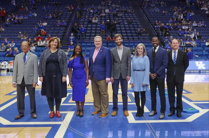 Derek Lane (fourth from left) and other 2023 Great Teacher Award winners were honored during an on-court recognition during the UK-Arkansas game Tuesday, Feb. 7, at Rupp Arena. Mark Cornelison | UK Photo