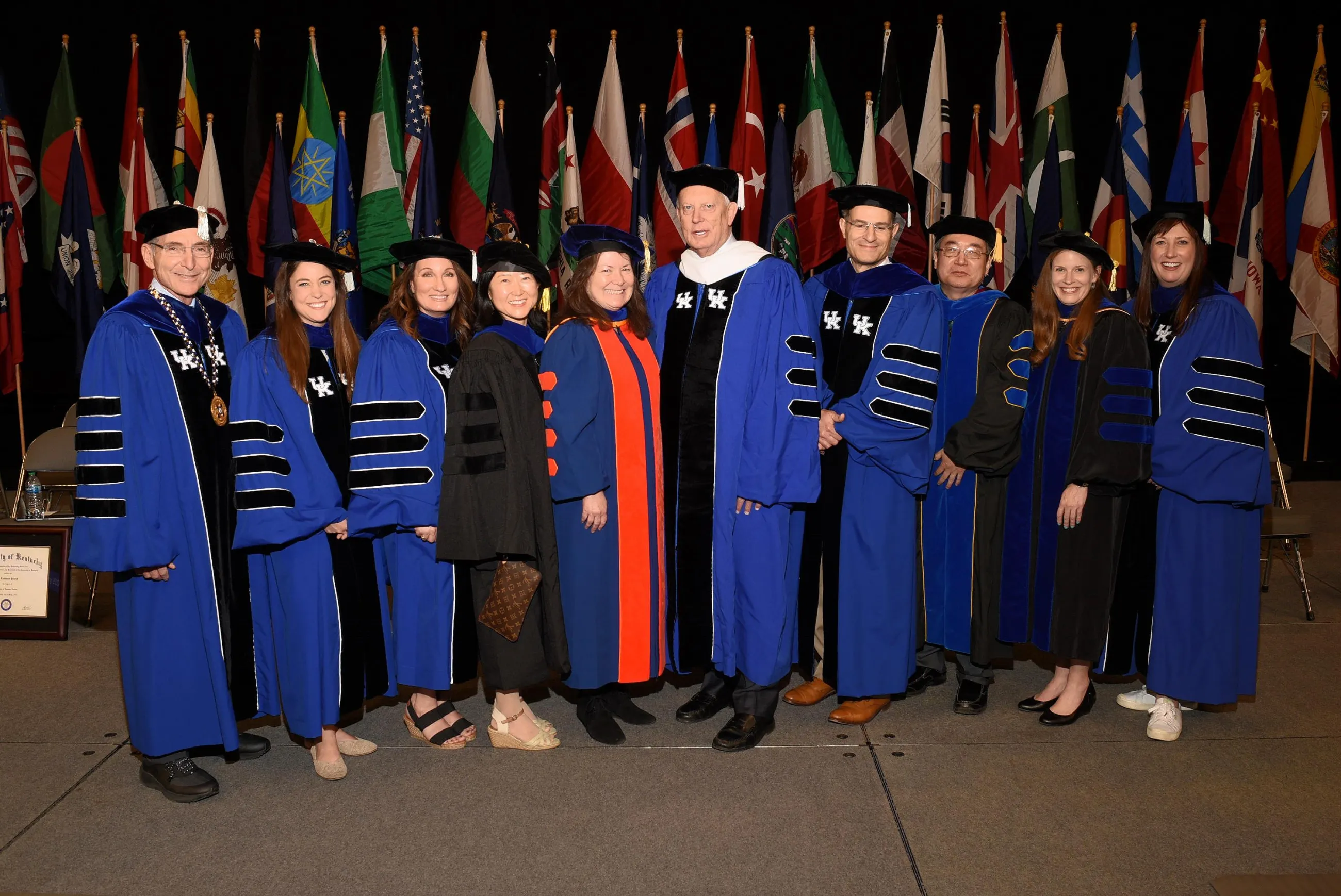 W. Lawrence Patrick (center) shown with (from left to right): UK President Eii Capilouto, Sarah Geegan, Liz Spencer, Deborah Chung, UK Provost Robert DiPaola, Zixue Tai, Brandi Frisby and Erin Hester after receiving his honorary doctorate at the May 2023 commencement ceremony.