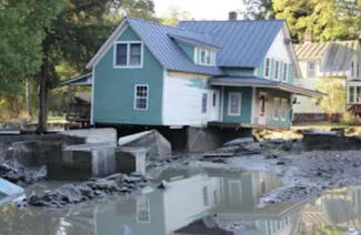 House in Bethel, Vermont, severely damaged by Hurricane Irene. (USFWS from Flickr Creative Commons via SEJ)