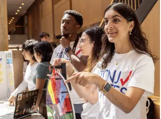 College students working to get youth registered to vote. (Photo by Yunuen Bonaparte, Hechinger Report)