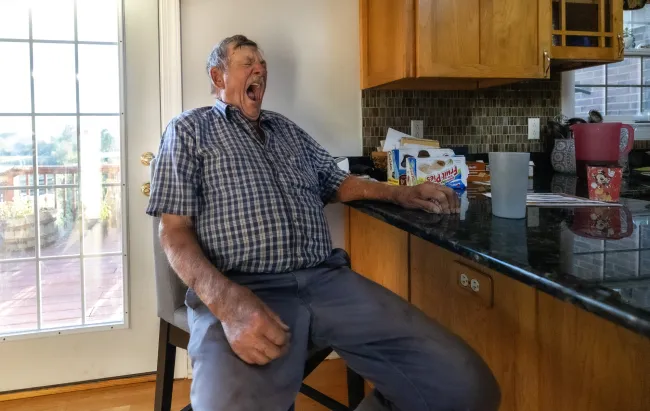 Martin Henson yawns in his home for lunch after working earlier that morning on Thursday, Oct. 12, 2023, in Franklin County, Kentucky. Photo by Matthew Mueller.