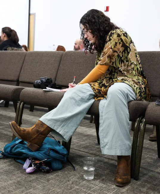 Cynthiana Democrat Regional Editor Kendall Staton takes notes on Tuesday, Jan. 23, 2024, during a school board meeting in Cynthiana, Kentucky. Photo by Abbey Cutrer.