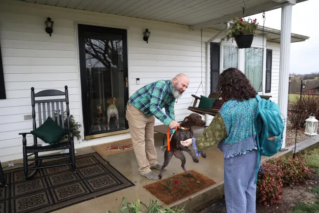 Cynthiana Democrat Regional Editor Kendall Staton greets retired Cynthiana fire chief Jay Sanders on Wednesday, Jan. 24, 2024, outside of his home in Cynthiana, Kentucky. Photo by Abbey Cutrer.