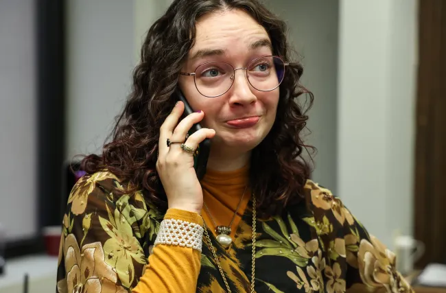 Cynthiana Democrat Regional Editor Kendall Staton talks to a local business owner on the phone on Tuesday, Jan. 23, 2024, at the Democrat office in Cynthiana, Kentucky. Photo by Abbey Cutrer.