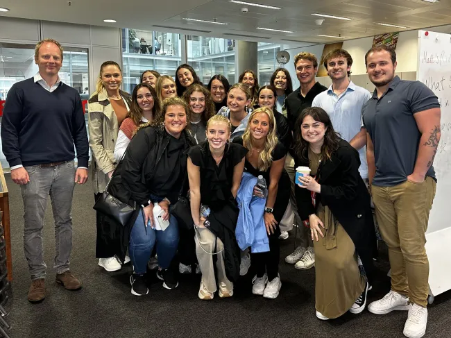 Study abroad students pose in Interbrand office