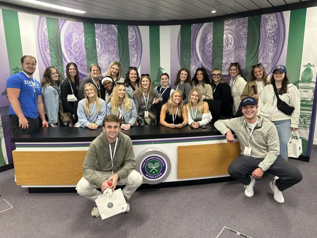 Study abroad students pose at Wimbleton