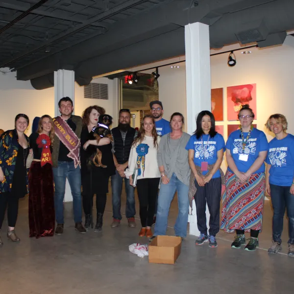 The three prize winners from the 2017 Carey Ellis Juried Student Show pose with juror and UK alumna Melanie VanHouten (in gray) and members of the Art Graduate Student Association, who helped organize Open Studio.