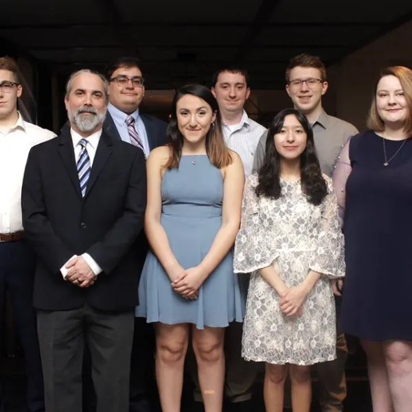 (Front row, left to right): Dave Arnett (coach), Jacinda Rivas, Maria Sanchez and Genevieve Hackman. (Back row, left to right): Dan Bannister, Amar Adam (coach), Lincoln Garrett (coach) and Anthony Trufanov. Photo provided by the NDT.