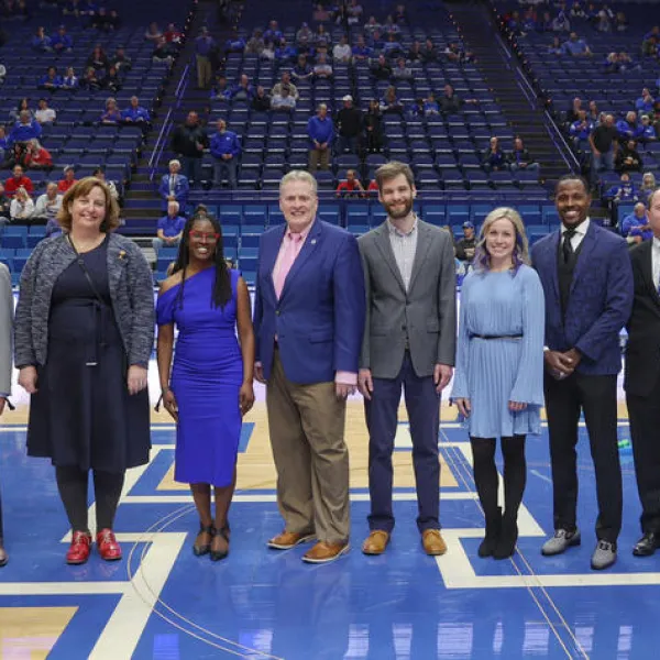 Derek Lane (fourth from left) and other 2023 Great Teacher Award winners were honored during an on-court recognition during the UK-Arkansas game Tuesday, Feb. 7, at Rupp Arena. Mark Cornelison | UK Photo