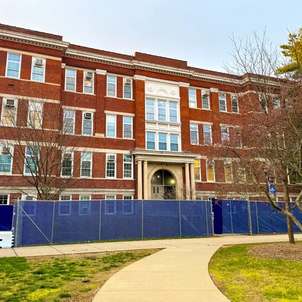 Construction fencing went up around Pence Hall in March 2024.